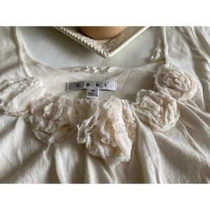 Ivory Knit Top by CAbi Medium Cap Sleeves Rosette Accented Neckline Bubble Hem